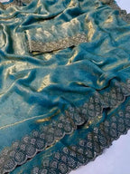 Graceful Teal Silk Blend Saree Accented With Swarovski Stone Work & Delicate Lace Border