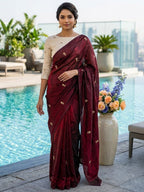 Elegant Maroon Organza Satin Silk Saree Featuring Floral Butti Sequins Embroidery & Tassel Pallu
