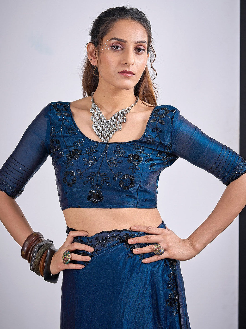 Glamorous Blue Satin Silk Saree Featuring Rich Stone Work With Cut Dana & Sequins